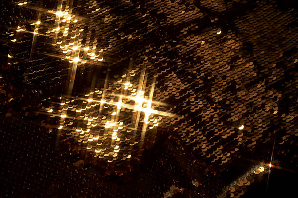 istock Abstract festive gold background made of sequins. 2240053878
