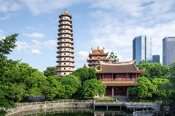 istock Ancient Pagoda and Traditional Architecture Reflecting Modern Urban Landscape 2240054910