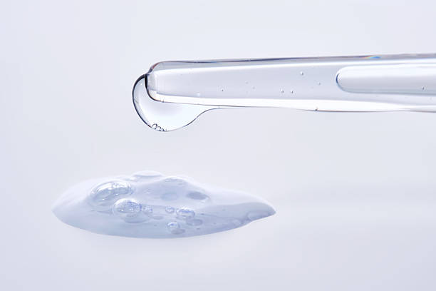 istock Pipette with delicate blue serum close-up. 2240056628