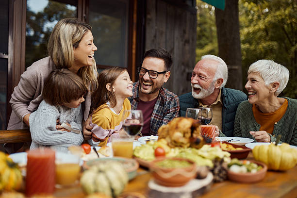 istock Cheerful extended family having fun during lunch on a terrace. 2240057533