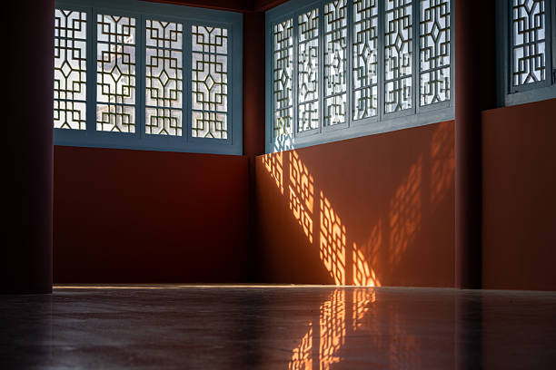 istock A Serene Space Illuminated by Traditional Lattice Window Patterns and Sunlight Shadows 2240057661
