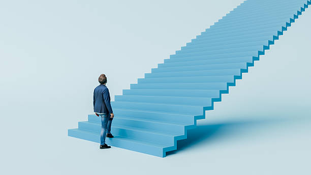 Business man climbing long blue staircase while looking upward toward success, ambition, opportunity, growth, determination - 3d render