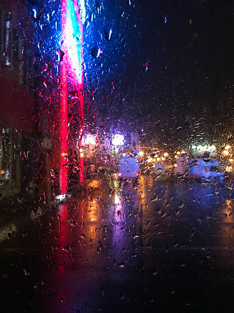 Window, rain, road. A window with raindrops on it