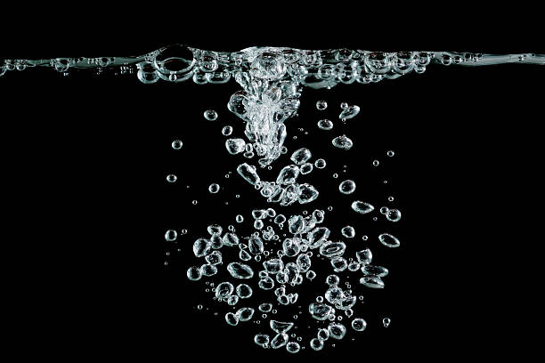 istock Clear water bubbles rising underwater on a black background, perfect for freshness concept, beverage design, splash effect, motion art, and clean natural background compositions. oxygen bubbles 2240061523