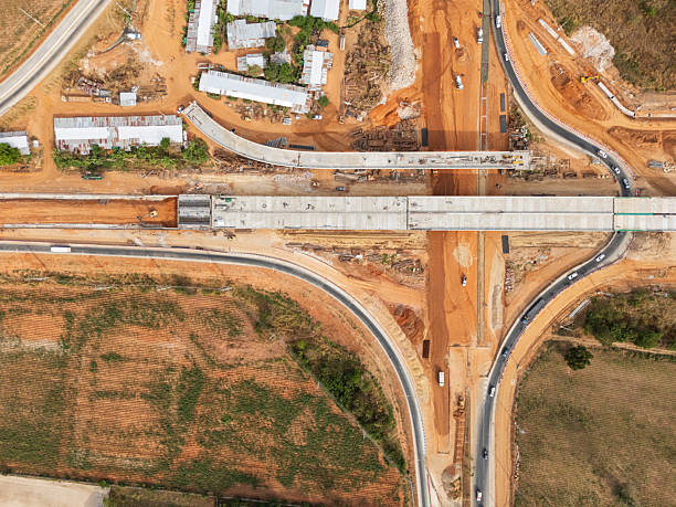 istock The construction site before the construction of the concrete bridge over the intersection by crane workers, tractors, and backhoes 2240061621