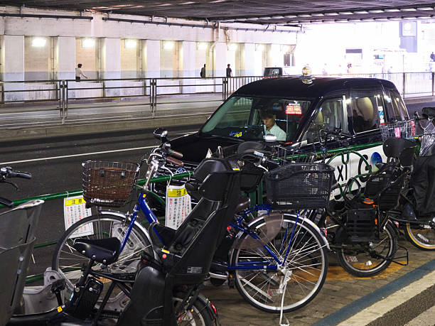 Tokyo, Japan - October 9, 2025: A taxi driving waiting in the Koto Ward of Tokyo Japan.