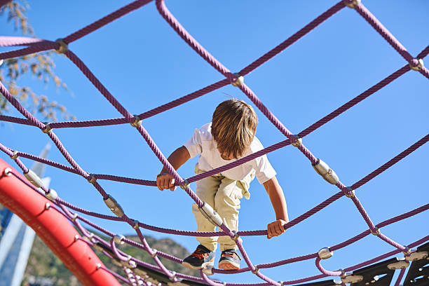 istock Young boy having fun at the playground outdoors 2240063143