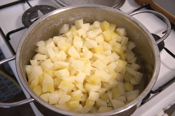 istock Cubed boiled potatoes in cooking pan, close-up 2240064622