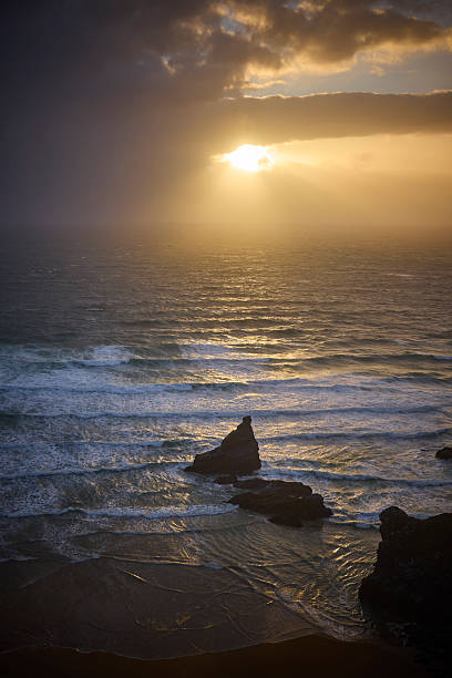istock Dramatic sky, Sunset above the Bedrutheran Steps in Cornwall, England, UK 2240065319