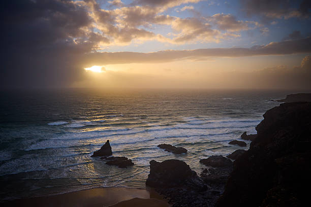 istock Dramatic sky, Sunset above the Bedrutheran Steps in Cornwall, England, UK 2240065326