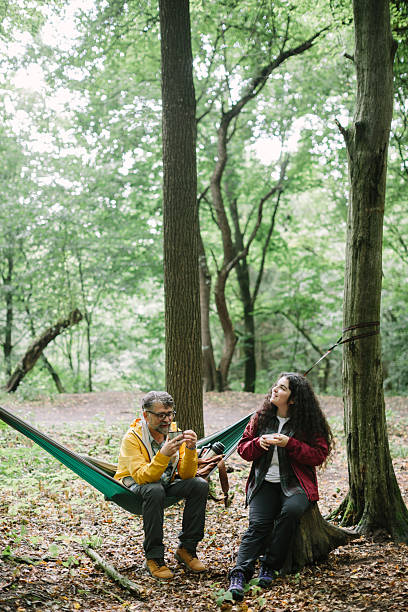 istock Father and daughter taking break enjoying nature 2240066108
