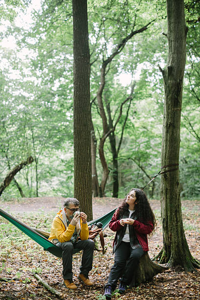 istock Father and daughter enjoying outdoor break in forest 2240066112