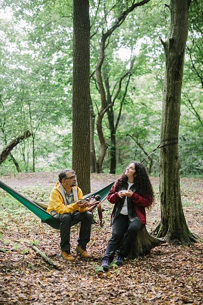 istock Father and daughter relaxing during forest hike 2240066113