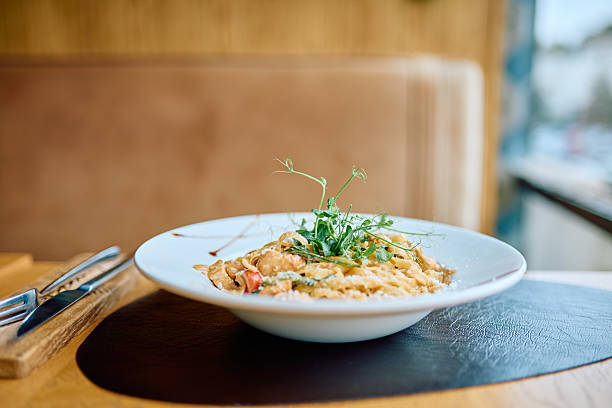 istock Creamy seafood pasta dish served in restaurant 2240067300