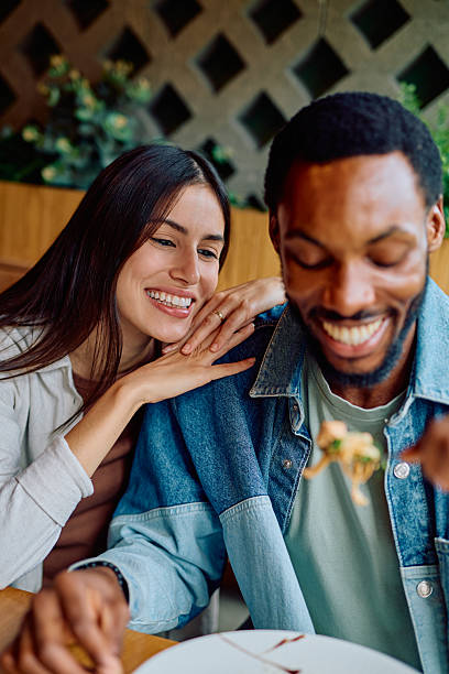 istock Diverse couple enjoying dinner date at restaurant 2240069318