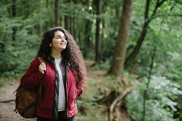 istock Daughter hiking through forest enjoying nature 2240070090
