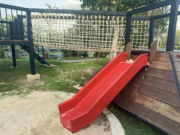 red slider with sand pit at the playground daytime