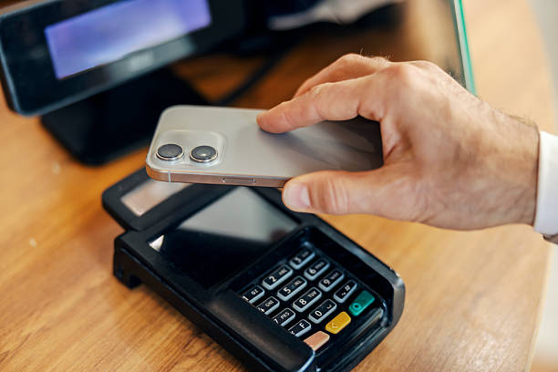 istock Paying with contactless smartphone on pos terminal 2240073303