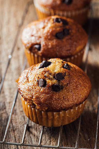 istock Freshly Baked Muffins with Chocolate Chips on a Cooling Rack 2240075209