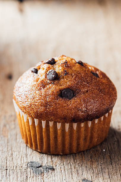 istock Delicious Chocolate Chip Muffin on Rustic Wooden Background 2240075224