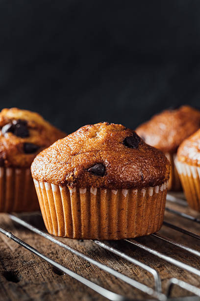 istock Freshly Baked Chocolate Chip Muffins on Cooling Rack 2240075237