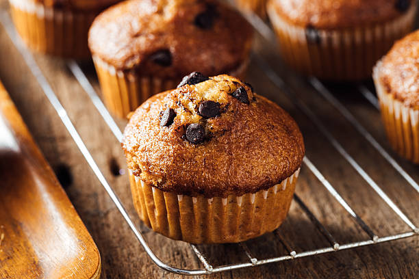 istock Freshly Baked Chocolate Chip Muffins on a Cooling Rack 2240075251
