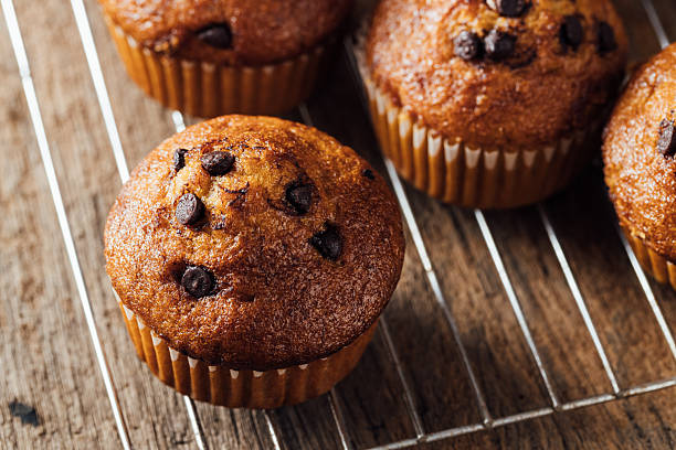 istock Delicious Chocolate Chip Muffins Freshly Baked on Cooling Rack 2240075259
