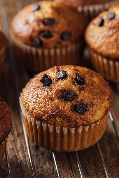 istock Freshly Baked Muffin with Chocolate Chips on Cooling Rack 2240075292