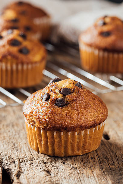 istock Delicious Homemade Chocolate Chip Muffin on Rustic Wooden Surface 2240075305