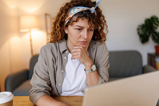 istock Tired woman working from home office 2240075585