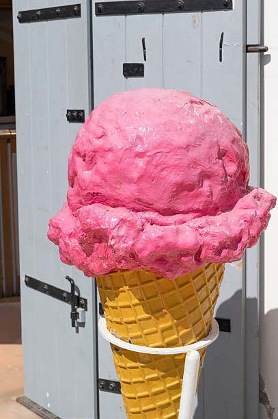 istock A Vibrant and Colorful Pink Ice Cream Cone Display under the Warm Sunshine Today 2240077477