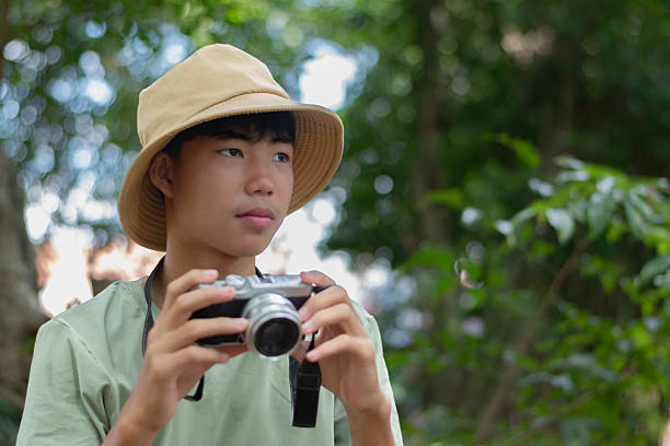 istock Nature study of Asian teenaged boy 2240077646