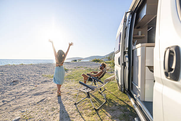istock Couple Camping in Motor Home on Beach 2240078977