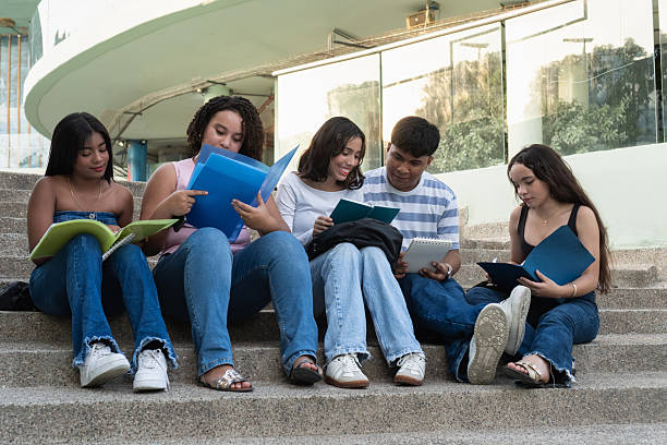 Group of students working together on a report or homework assignment and discovering different knowledge in the university library.