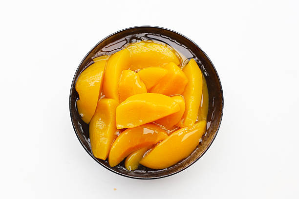 istock Sliced peaches in syrup served in a bowl 2240080910