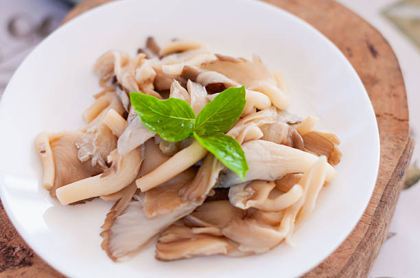 Delicious sauteed mushrooms with fresh basil home kitchen food bright lighting culinary delight