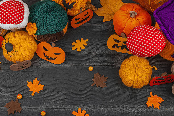 istock Dark Halloween atmospheric composition. Handmade knitted, crocheted, and sewn autumn decor 2240083058
