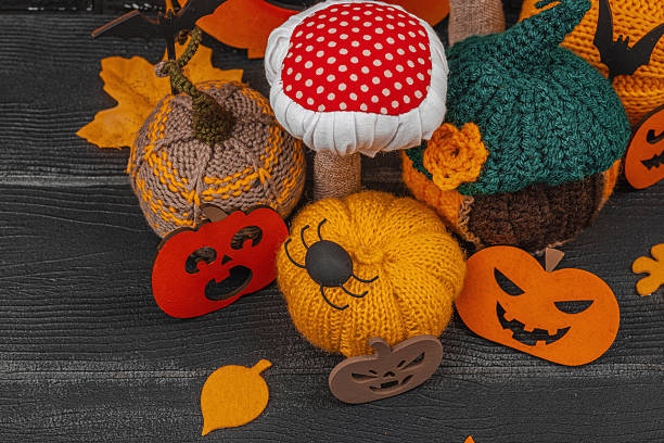 istock Dark Halloween atmospheric composition. Handmade knitted, crocheted, and sewn autumn decor 2240083061