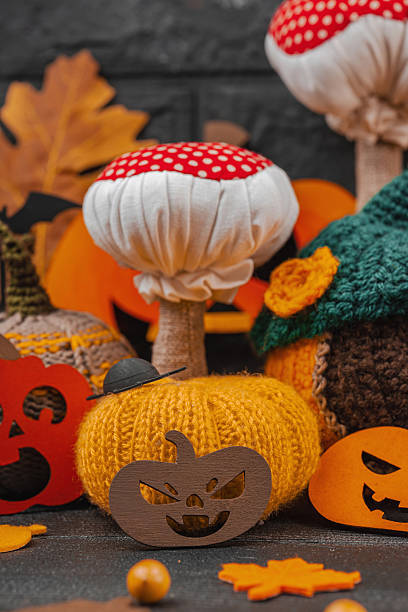 istock Dark Halloween atmospheric composition. Handmade knitted, crocheted, and sewn autumn decor 2240083073