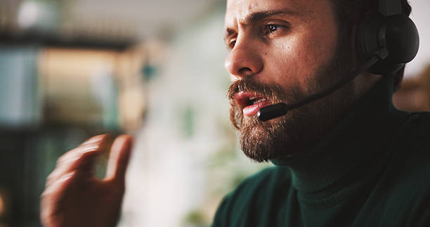 istock Man, mic and phone call with mouth at callcenter for communication, customer support and space. Headset, telecom and contact us with male consultant for chat with client, advice or help desk office 2240085952