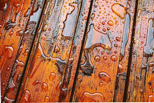 wooden boards with water drops, covered with protective oil against moisture
