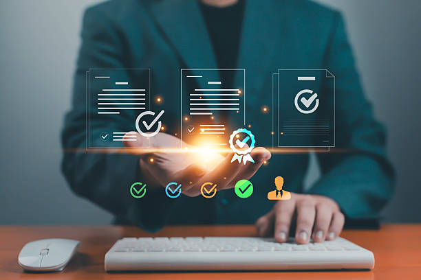 istock Businessman holding virtual approved documents with check mark icons, concept of certification, business approval, digital document management, and modern technology for workflow efficiency. 2240087190