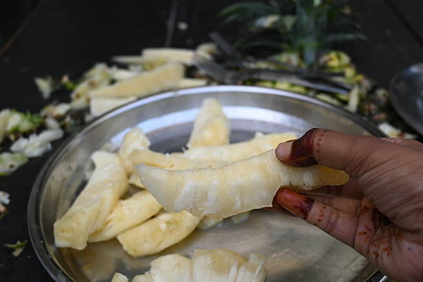 istock Pineapple or Ananas comosus chopping with knife. 2240089173