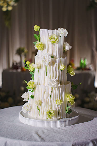 istock Elegant wedding cake decorated with flowers at a reception event 2240090592