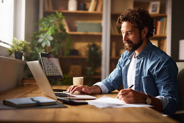 istock Focused freelancer working from his home office 2240092194