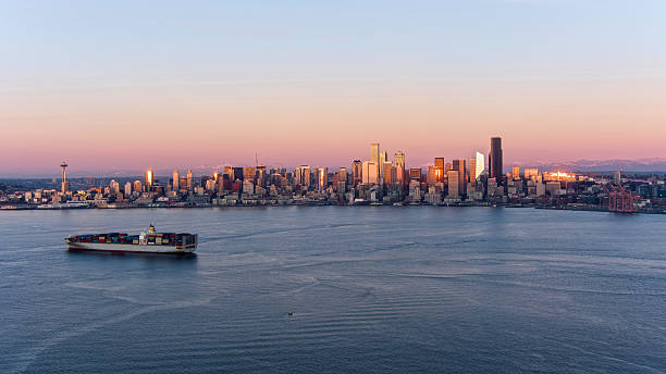 Drone shot of the Seattle skyline and Elliot Bay at sunset in December