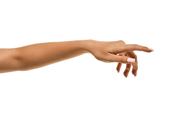 istock Female hand with white manicure in elegant reaching gesture isolated. 2240095000