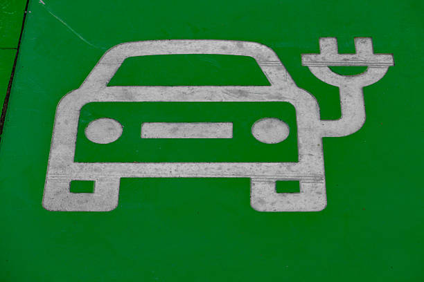 istock Electric vehicle parking space with green pavement marking 2240101716