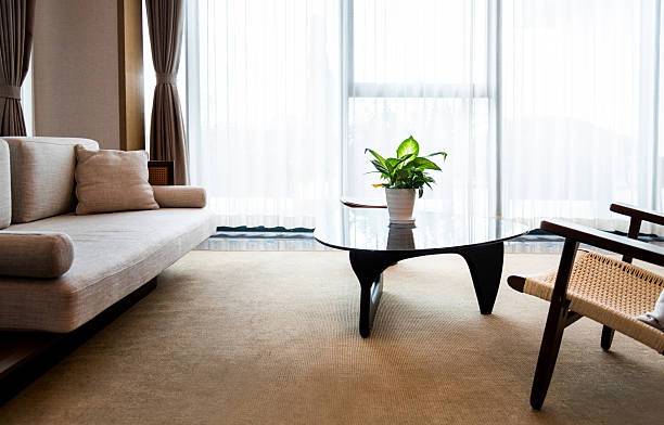A simple living room showcasing with white coffee table in scandinavian style