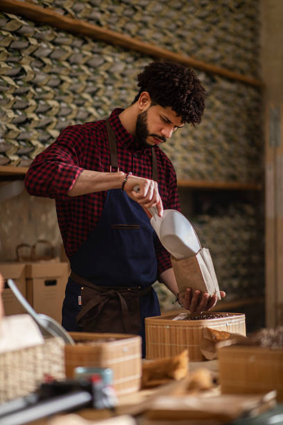 istock Man Preparing Handmade Goods in Artisan Workshop with Traditional Tools and Materials 2240106084